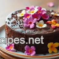 Indulge in My Elegant Chocolate Cake Adorned with Edible Flowers