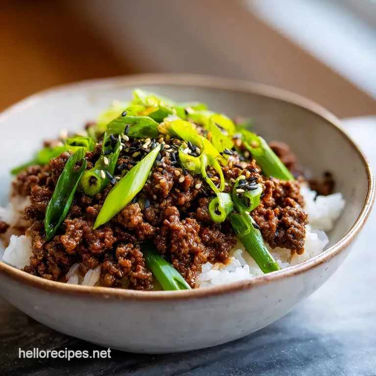 Perfectly arranged bulgogi bowl with vibrant marinated beef, crisp shredded carrots, and fresh greens, drizzled with savor...