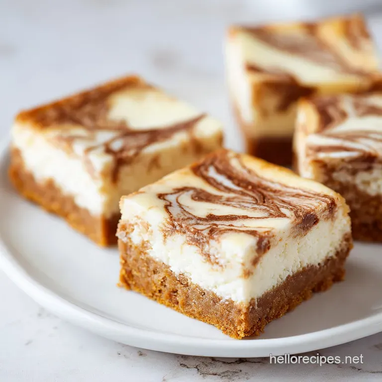 Neatly stacked creamy dessert squares on a white ceramic plate, garnished with a dusting of powdered sugar.